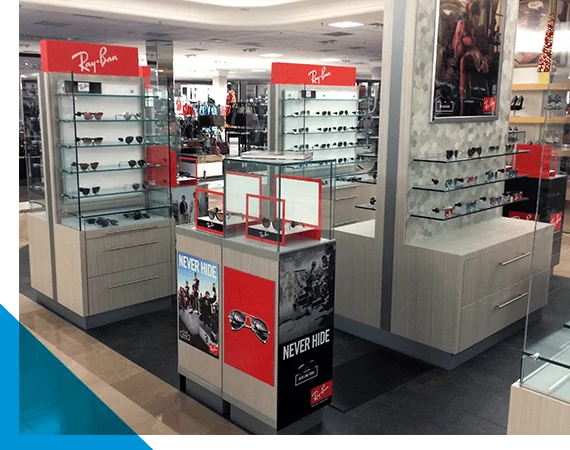 Eyewear display stands and glass shelving inside a modern retail store environment
